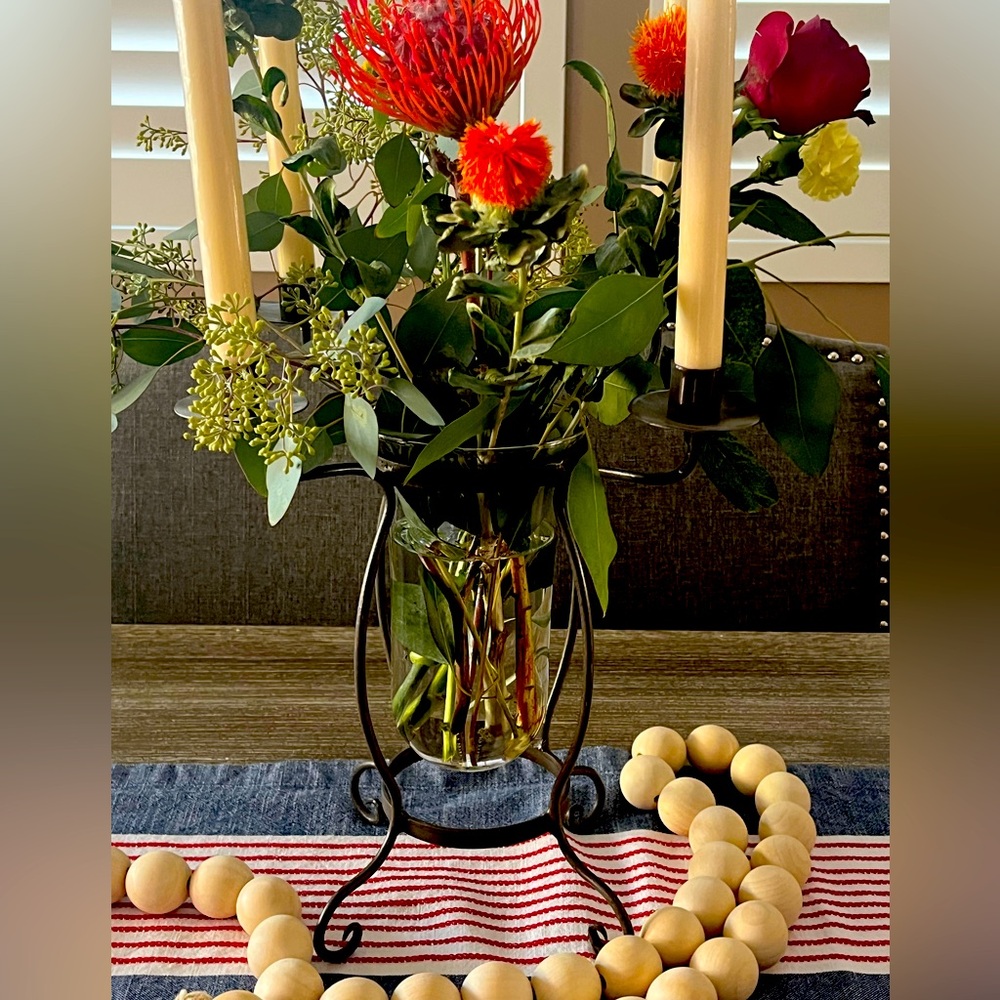 Iron Vase with four candle sticks.